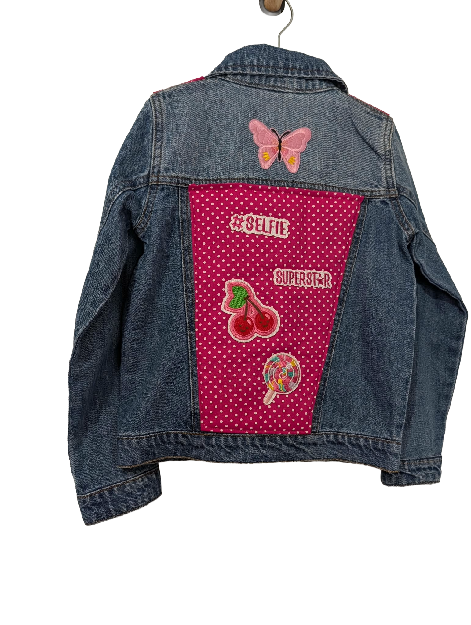 Girls denim jacket with pink polka dot back panel and selfie superstar patches